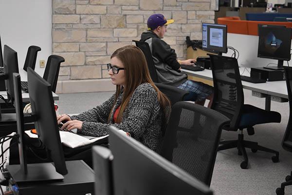 A student working at one of the computers in the Shake Resource Center